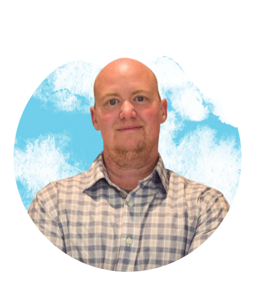 portrait of corey webster in front of a paint splash